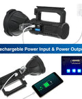 Go To Beast Mode 100000 Lumen Spotlight Flashlight With Tripod IPX5 Waterproof Handheld Search Light charging a phone