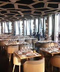 Elegant restaurant setting with table lamps, featuring 2 Pack Cordless Rechargeable LED Table Lamps With 5000mAh Battery No Fuss Portable Battery Powered Desk Lights For Restaurant And Outdoor Use Up To 40 Hours Runtime 3 Level Stepless Dimming Gold.