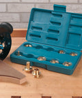 11-Piece Router Guide Bushing Kit for Templates, Patterns, Or Jigs with storage case and brass bushings on wooden table