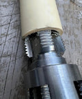 Close-up of TAODAN 2-Piece Universal Electric Pipe Threader Kit For 1/2 And 3/4 Inch PVC Pipes Carbon Steel Cutter on PVC pipe.