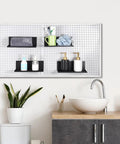 Six Pack Magnetic Pegboard Shelves With Lip Edge for garage and workshop shown in bathroom holding toiletries.