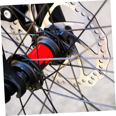 Close-up of Bombproof Mechanical Disc Brake Rotor Kit For Mountain Bike featuring Front And Rear 160 Mm Silver Rotors on wheel hub.