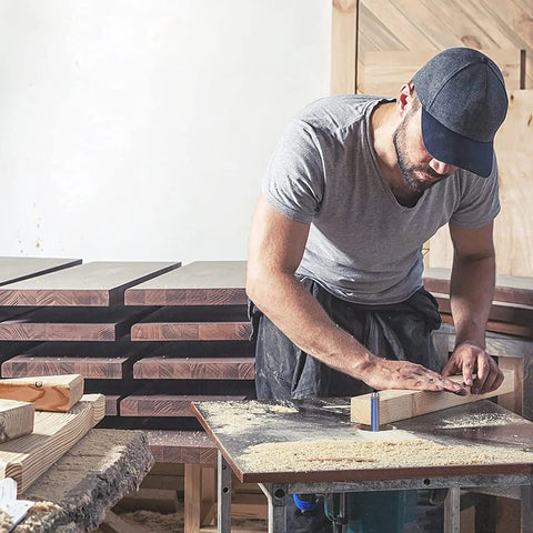 Person crafting wood piece using Pro Grade Top Bearing Flush Trim Router Bit Set Of 4 With 1/4 Inch Shank Cut To Heights Of 1/4, 5/16, 3/8 And 1/2 Inch For Veneer And Shelf Edge Trimming And Flush Finishing.