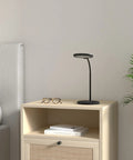 LED Desk Lamp With USB Charging Port, Eye Caring Circular Design With No Flicker on nightstand in bedroom