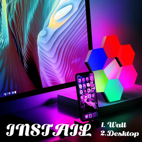 Hexagon Geometric RGB Wall Light Kit With Remote Control Touch Sensitive Modular Panels USB Powered Color Changing LED Mood Lighting For Bedroom 6 Pack Easy Install on a desk beside a monitor.