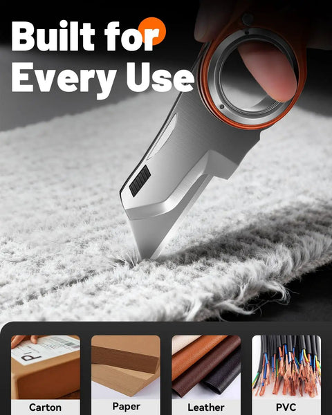 Badass Folding Utility Knife With Secure Finger Loop And Quick Swap Razor Blades For Heavy Duty Box Cutting On The Job Or Around The Workshop And Basement cutting fabric with finger loop.