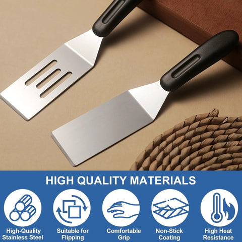 Two stainless steel kitchen spatulas with black handles; one slotted with three slots and one solid flat spatula.