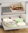 Heavy Duty Pull Out Cabinet Organizer Shelf Expanding From 16 To 21 Wide Fits 13 To 17 Depth with pots and jars in use.