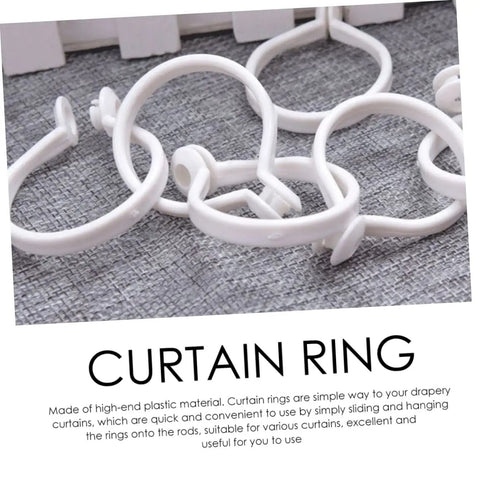 60 Pack Plastic Circular Curtain Rings For Rods With Smooth Glide No Burr, detailed view on grey surface
