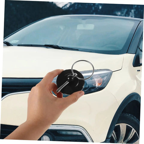 Durable CNC Aluminum Hood Lock Kit in hand with car background, Ideal for cars, trucks, and SUVs, easy install, secure fit.