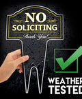 Hand holding No Soliciting yard sign made from heavy-duty DiBond aluminum with weatherproof checkmark, discreet residential look.