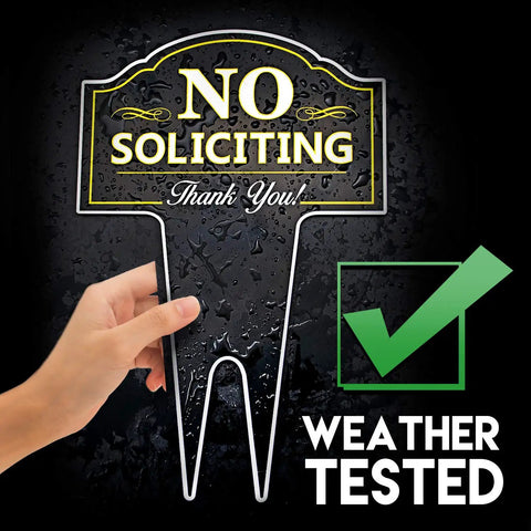 Hand holding No Soliciting yard sign made from heavy-duty DiBond aluminum with weatherproof checkmark, discreet residential look.