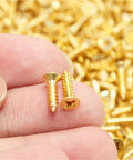 Beefy Brass Countersunk Wood Screws Self-Tapping M3x30 20Pcs Set in hand, showing dual end locking design
