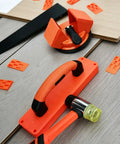 Pro Grade Laminate Floor Installation Kit with Tapping Block, Pull Bar, Rubber Mallet, and Floor Spacers on wood planks.