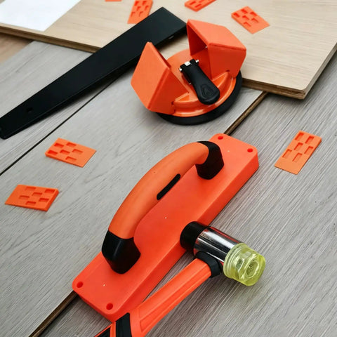 Pro Grade Laminate Floor Installation Kit with Tapping Block, Pull Bar, Rubber Mallet, and Floor Spacers on wood planks.