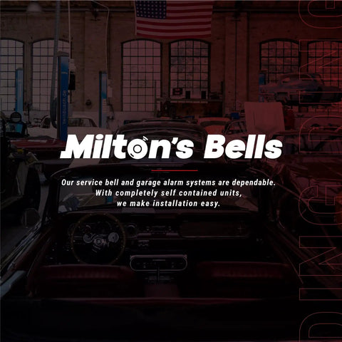 Milton's Bells service and garage alarm systems in automotive workshop with visible cars and large windows