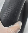 Gloved hand holding Heavy Duty Butyl Rubber Inner Tube For 8 Inch Tires 3.00-8 3.25-8 Dual Wheel Yard Wheelbarrow Garden Cart Replacement 1 Pack With TR87 Bent Valve Stem Built For Tough Outdoor Work And Easy Inflate Ready To Install
