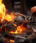 Blacksmith using Five Piece Blacksmith Tools Kit With Pro Grade V Bit Tongs near fire during metalworking.
