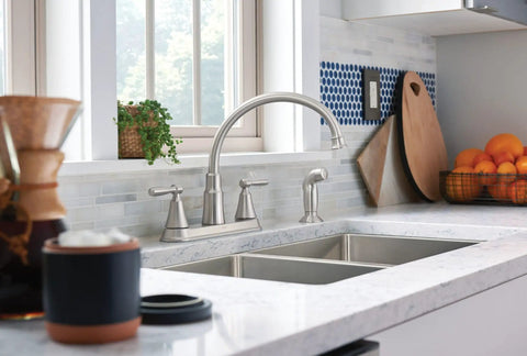 Hutchinson Spot Resist Stainless 2-Handle High Arc Kitchen Faucet With Side Sprayer in modern kitchen setting