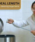 Person using 47 Inch Stainless Steel Bidet Hose Replacement Kit with Brushed Nickel Finish to clean bathroom