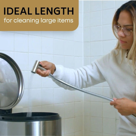 Person using 47 Inch Stainless Steel Bidet Hose Replacement Kit with Brushed Nickel Finish to clean bathroom