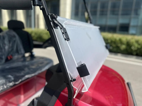 Top Tier Four Seater Electric Golf Cart Built With A Solid Front Bumper And Aggressive Off Road Tires Including HD LED Smart Dashboard showing a clear windshield mount.