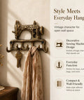 Slick Vintage Cast Iron Sewing Machine Wall Hook Rock Solid For Hanging Coats And Everyday Keys with scarf and keys.
