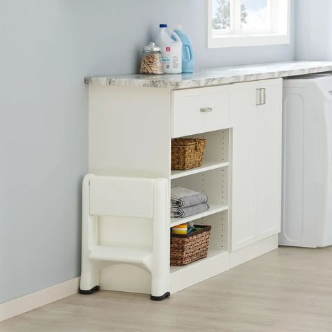 Two Step Folding Foot Stool, 14 Inch High, 300 Pound Capacity, Grab And Go Lightweight, stored flat in laundry room