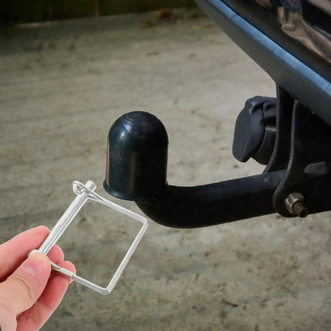 Heavy Duty 6 Pack Square Trailer Hitch Coupler Safety Pins With Lanyards Plus Locking Cotter Keys, silver square pin in hand near trailer hitch.