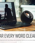 Minimalist USB-C Desktop Speakers With Bluetooth 5.0, 8W RMS, 2.25-Inch Drivers next to laptop on wooden desk