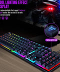 RGB backlit mechanical keyboard with cool lighting effect, visible on wooden desk, features scroll lock light and on/off button.