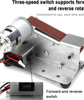 3-In-1 Mini Belt Sander And 7-Speed Knife Sharpener With Bench Grinder Attachment For Metalworking and DIY Projects detail showing motor and three-speed switch.