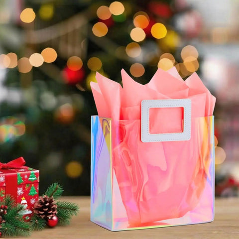 8.3 Inch Holographic Gift Bag With Coral Tissue Paper Reusable Small Tote For Birthdays Bridesmaids Weddings Girls And Women Iridescent Party Favor Pack Of 1 Size Small Party Ready on a table with holiday lights