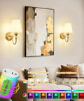Battery Operated Wall Sconces Set of 2,Rechargeable Wireless Wall Sconces with 10000mAh RGB Dimmable Bulb and Remote,15 Colors Cordless Wall Lights for Bedroom,Bathroom,Living Room & Hallway(Gold) illuminating artwork on a living room wall.
