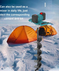 Cordless Electric Ice Auger With Six Speed Settings From 100 To 800 RPM And 1200 Nm Torsion Power Head next to an orange tent on ice