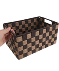Top Shelf Clothing Storage Bin With Reinforced Metal Frame And Grippy Polyester Weave Handles shown in hand, featuring a brown and beige checkered design.