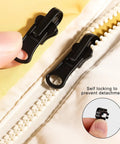 Universal Zipper Repair Kit 9 Pack With Small Medium Large Sliders And Three Zipper Pulls installed on white jacket zipper.