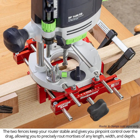 Ultra Premium Adjustable Dual Fence Mortise Base For Plunge Routers With 3/8 Guide Rods on a woodworking table.