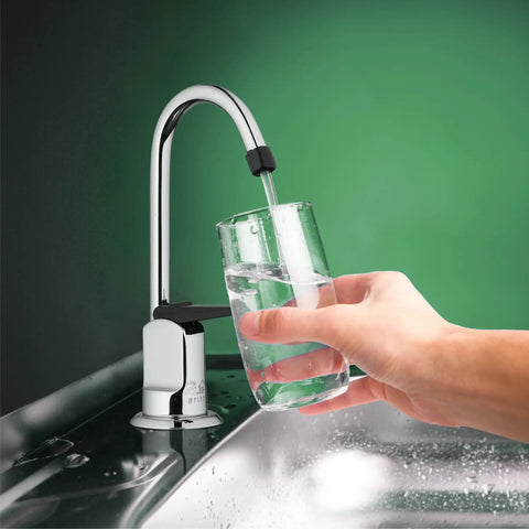 Top Shelf One Handle Low Arc Chrome Faucet For Countertop With Lead Free Drinking Water Flow and Slick Spot Resistant Coating pours water into a glass.