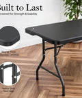 Close-up of Six Foot Folding Table With Carrying Handle That's Built Tough For Indoor And Outdoor Parties, focusing on tabletop and legs.