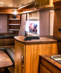 Rubber Draw Latch With Hook Style Design, Marine Grade Locking Latch on RV countertop, showcasing black durable build