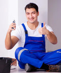 Technician holding Two Pack Electric Control Cabinet Keys Set With Double Joint Cabinet Panel Keys, seated in blue workwear.