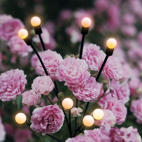 Bright Solar Outdoor Garden Spotlights Eight Head LED Landscape Lights amidst pink flowers, waterproof IP65, solar powered