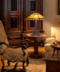 Cream Tiffany Style Table Lamp With 24 Inch Tall, 16 Inch Square Stained Glass Shade on a Mission-style side table.