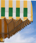 Colorful striped awning on a bright day, suitable for Heavy Duty RV Repair Tape For Awnings Canopies Tarp Sail Tent Trampoline Quick Fix Rainproof Flexible Self Adhesive Repair Tape Waterproof Industrial Strength For Long Lasting Repairs And Quick Fixes.