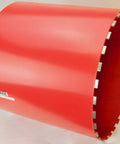 Red 18-inch diamond core drill bit with segmented rim, side view; BlueRock Tools.
