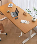 Get Your Posture Locked In With This Cherry Wood Manual Standing Desk And Straight Up Game Changing Crank Lift Mechanism For Home Offices Or Bedrooms Boasting A Foldable Handle And Massive Work Surface, featuring a spacious wooden top, a laptop, and a manual crank.