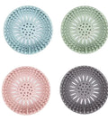 Slick Silicone Drain Strainers With Hair Catcher For Shower Bathroom Sink And Tub Tough Flexible Plughole Cover in four colors.