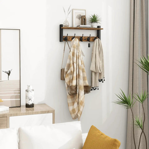 Rustic Wood Wall Shelf With Five Metal Hooks Coat Rack For Your Entryway Hallway Bathroom Mudroom And Bedroom Keeps Hats Coats Purses Towels Sorted And Chic In Rustic Brown And Black Finish, decorated with coats and plants