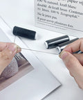 Hands holding thread from Hair Wig Making Kit With 20 Pcs Curved C J Shape Needles And Black Polyester Thread Portable Sewing Set